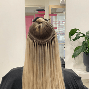 - Image suggestion: A photo of keratin bonds applied to hair, showcasing the discreet and natural look.